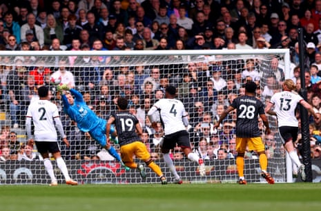 Fulham goalkeeper Bernd Leno saves a free-kick against Leeds United.