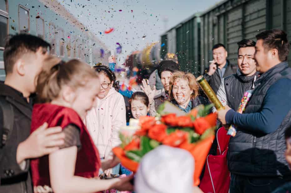 The Kazakh marriage tradition is complicated and requires several trips by the bride and groom. Here a newly married couple arrive in the groom’s home town