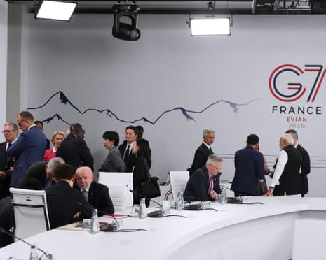 Leaders and invited guests prior to the start of a working session at the G7 summit in Evian-les-Bains, France.