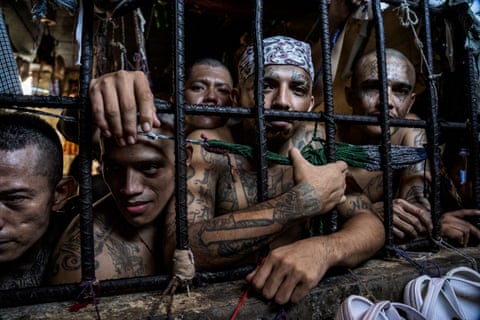 Members of the La 18 gang share a cell in the penal centre of Quezaltepeque