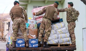 British troops distribute aid on the territory in anticipation of Hurricane Maria.