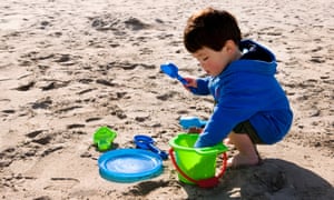 Little boy playing on the beach