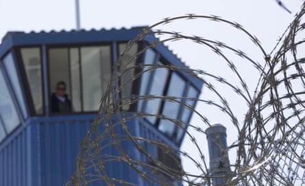 Barbed wire and a guard tower are seen at Pelican Bay state prison.