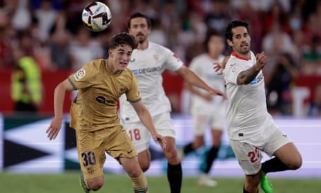 Sevilla’s Isco is wrongfooted as he sees Gavi have a chance to make a break for Barcelona