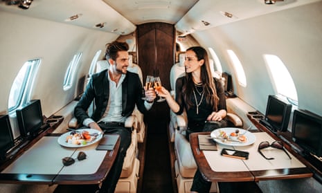 Couple toasting on plane