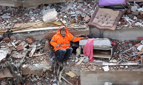 Mesut Hancer holds the hand of his 15-year-old daughter, Irmak, who died in the earthquake in Kahramanmaraş, close to the earthquake’s epicentre.