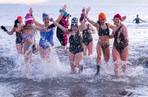 Hundreds of swimmers take a sunrise dip in the Firth of Forth at Portobello Beach for International Women’s Day. Money raised from the event is to be donated to the charity Women’s Aid and this year it is the 50th anniversary of the Edinburgh branch. See our live blog for more coverage of International Women’s Day