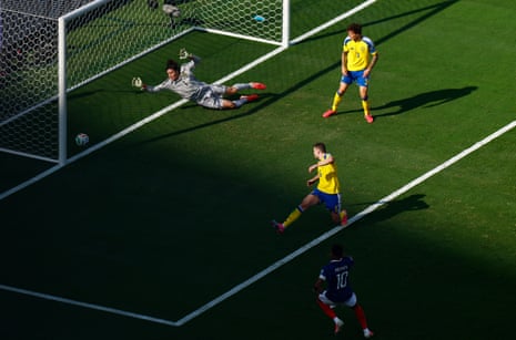 France's Kylian Mbappe shoots at goal and hits the post.