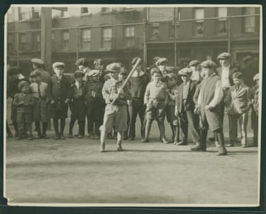 boys playing baseball in a school yard