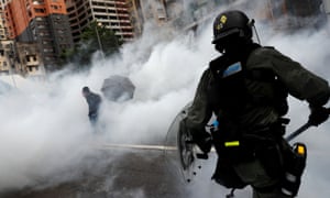 Police officer fires teargas