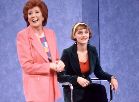 Cilla Black stands alongside a seated van Heel during the show