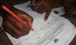 A citizen of West Papua signs the banned petition