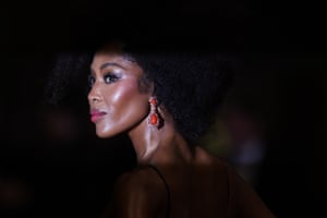 Naomi Campbell wearing a large red-jewelled earring