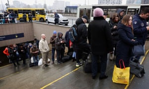 People wait at a bus station to go to western parts of the country in Kyiv, Ukraine