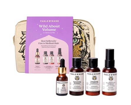 Fable & Mane Wild About Volume Travel Set. The bag and packaging sit behind the four included items.