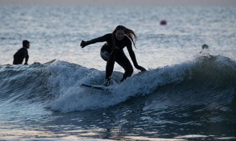 Riding a wave in Boscombe, Dorset
