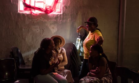 Karabo Ramabulana, 26, speaks with other facilitators from the mental health charity Phola, at a counselling session in Orange Farm township, South Africa.