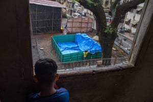 Workers install an artificial pond.