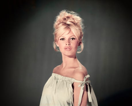 Brigitte Bardot wearing a light blue off-the-shoulder dress