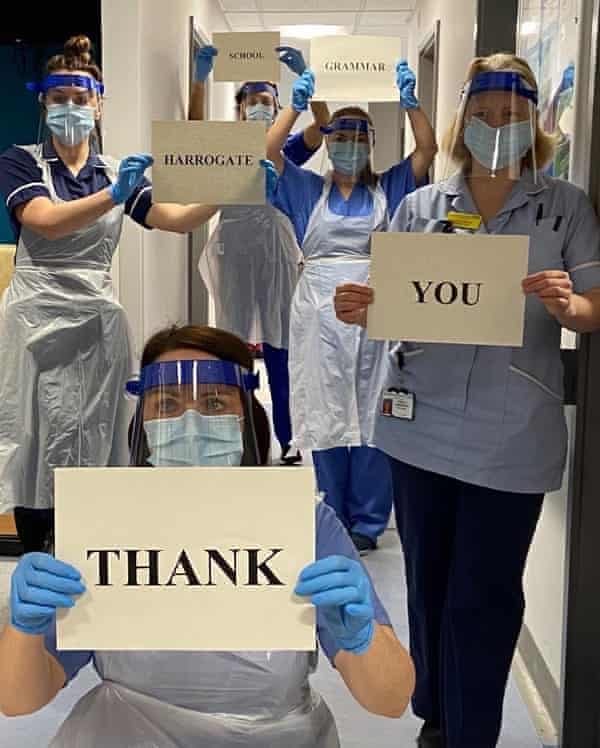 Staff at Harrogate district hospital wear visors made at Harrogate grammar school