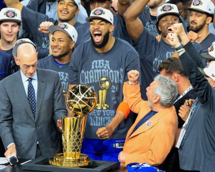 New York Knicks’ star Karl-Anthony Towns celebrates with the team’s owner, James Dolan, in San Antonio after sealing the NBA championship, 13 June 2026.