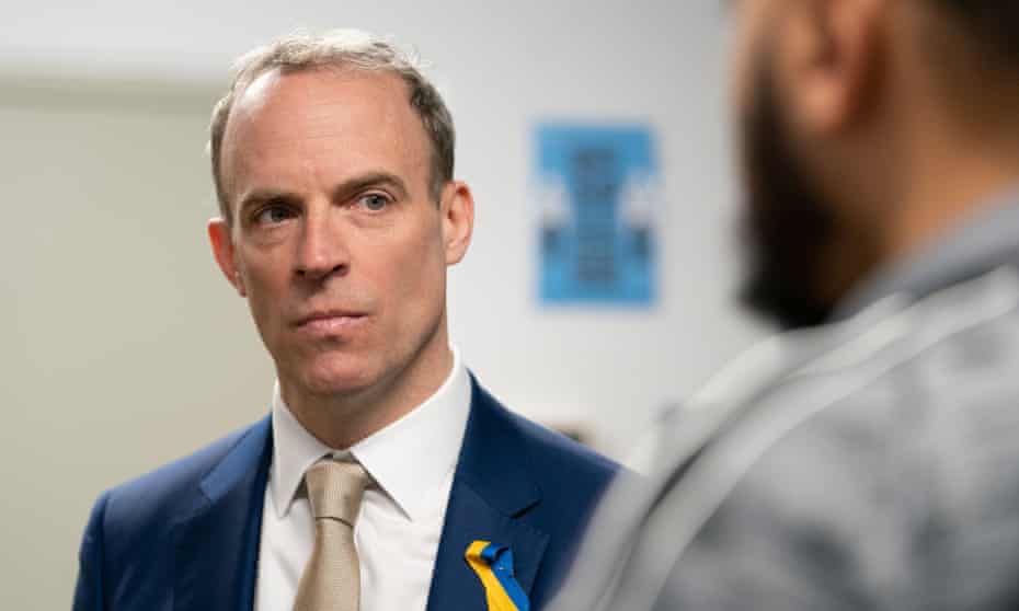 Dominic Raab wears a ribbon in the colours of the Ukrainian flag on a visit to a prison in Wellingborough on Thursday