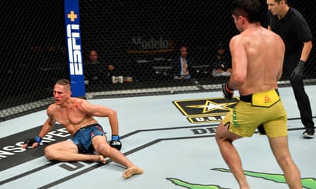 Niko Price is dropped by a punch from Vicente Luque in their welterweight fight.