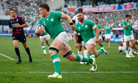 Joe Mccarthy scampers over the line to score Ireland’s ninth try against Romania.