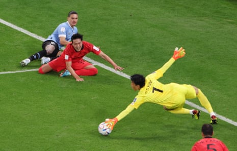 Korean goalkeeper saves from Kim Seung-gyu.