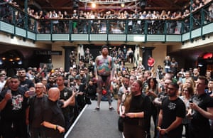Competitors pose for tattoo enthusiasts during the London Tattoo Convention at Tobacco Dock