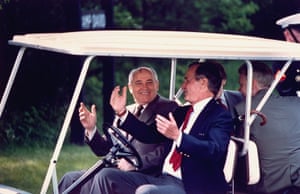 2 June 1990. Former President. Bush at the wheel of a golf cart taking with Mikhail Gorbachev at Camp David.