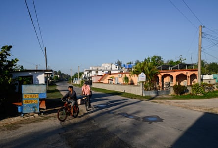 People ride their bicycles on an empty street in April as Cuba’s top tourist destinations remain deserted amid power and fuel shortages under US sanctions.