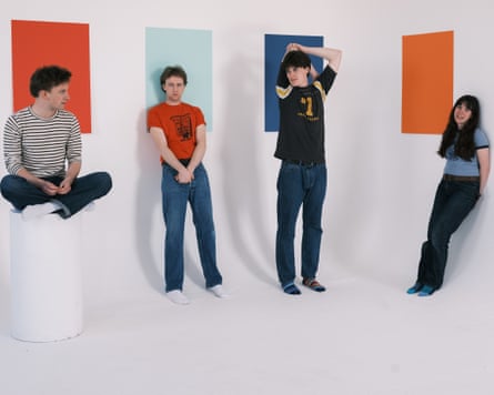 The four members of Westside Cowboy standing against a white wall covered in colourful rectangles
