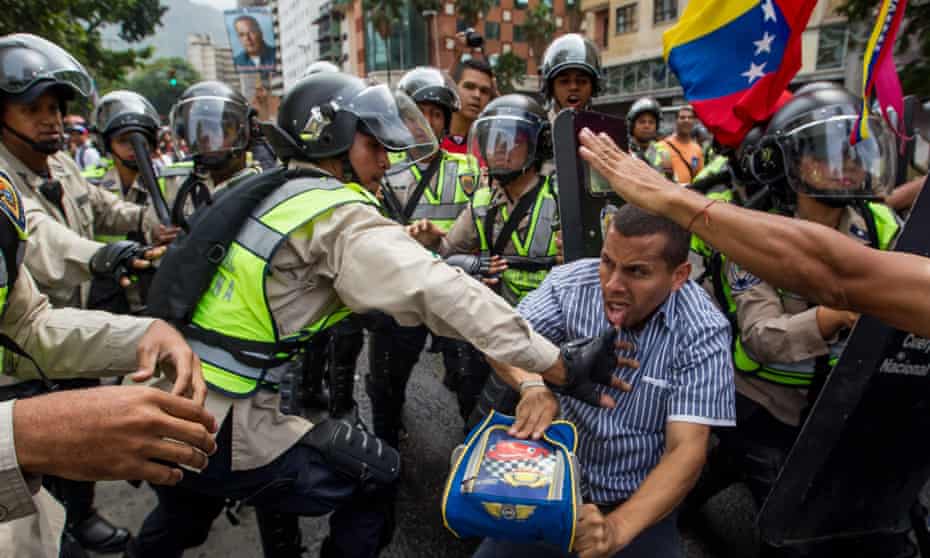 Demonstrators clash with police during a protest in Caracas.