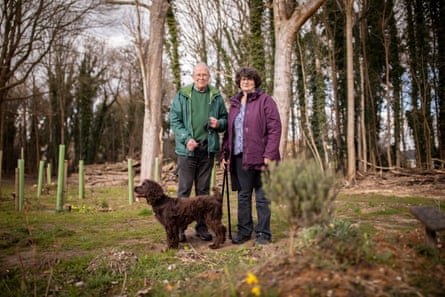 Richard Tingey and his daughter Heidi photographed near his wife Barbara’s woodland burial grave in Suffolk