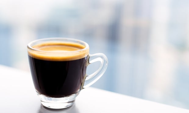 Tiny glass cup of espresso coffee 