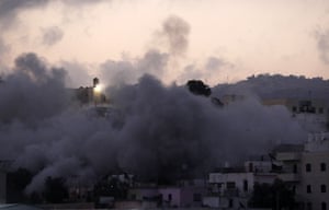 Smoke spreads over houses