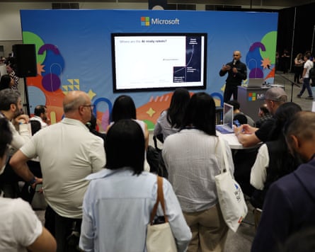 people gathered around a screen