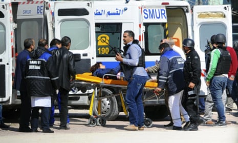 A victim is evacuated by rescue workers outside the Bardo musum in Tunis, Wednesday, 18 March, 2015