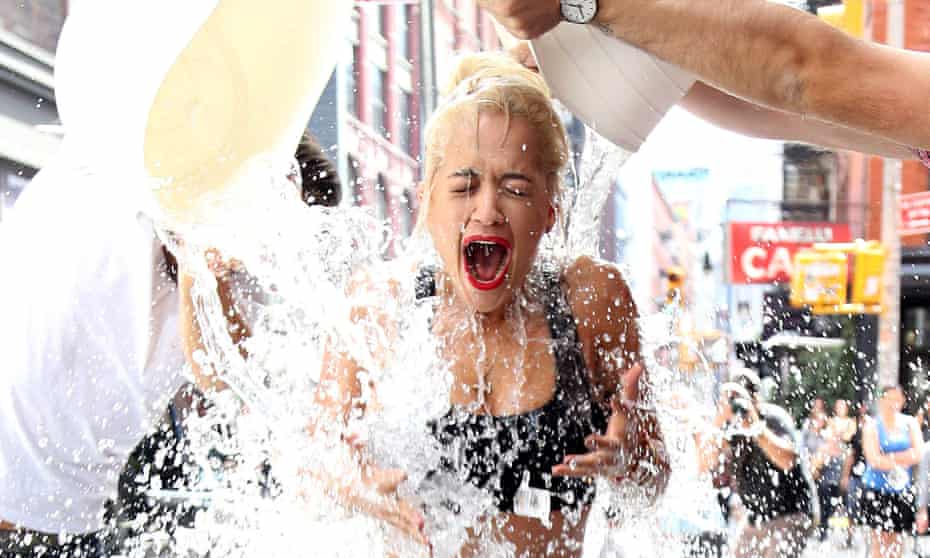Singer Rita Ora does the ice bucket challenge on the street in New York City. 