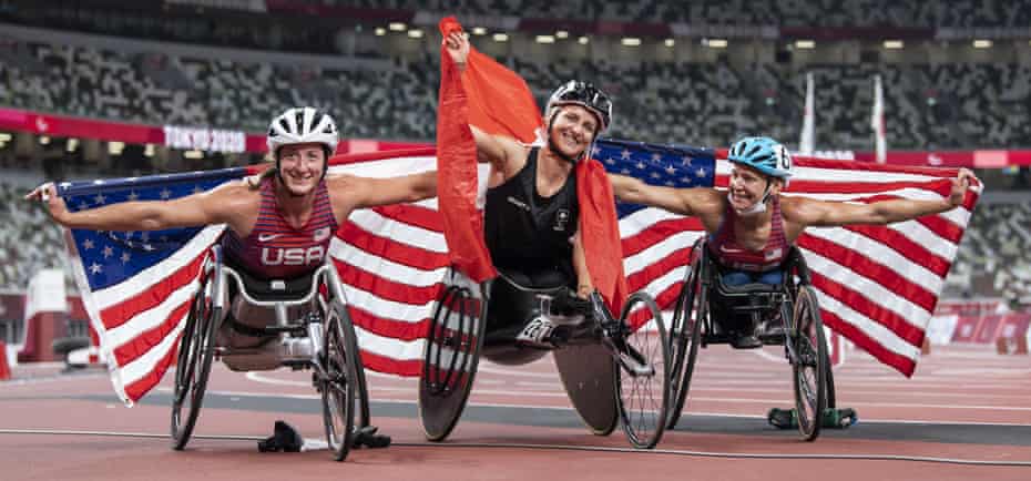 Manuela Schaer (C) of Switzerland poses with Tatyana McFadden (L) and Susannah Scaroni.