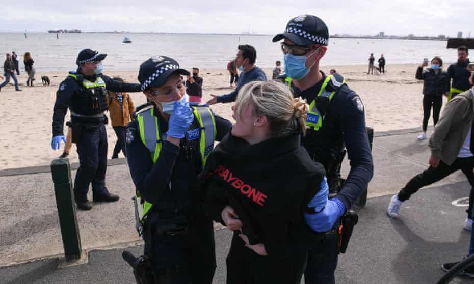 Victorian Covid cases surge to new record as protesters arrested and NSW warns of undiagnosed deaths | Australia news | The Guardian