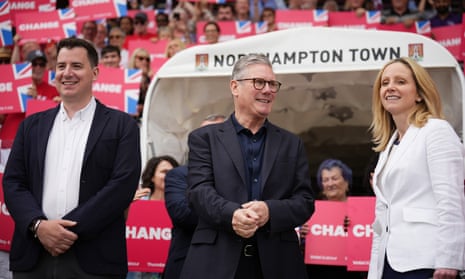 Labour leader Keir Starmer (C) and Labour candidates for Northampton North and South Lucy Rigby (R) and Mike Reader meet supporters at Northampton Town F.C. stadium on 24 June 2024 in Northampton, England.