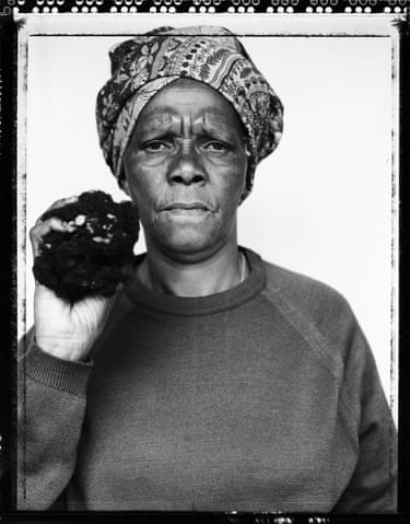 Mtimkulu, Zwide Port Elizabeth, 1997 (Truth and Lies 1996–2002)Holding the hair of her dead son in her home which she had kept for 20 years after it fell out when he was fed rat poison by the South African security police. She kept the hair in a black plastic bag which she took to the hearings so that it could be held up as evidence.