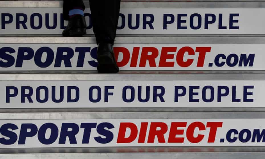 a man climbs steps with sports direct slogans such as 'proud of our people'
