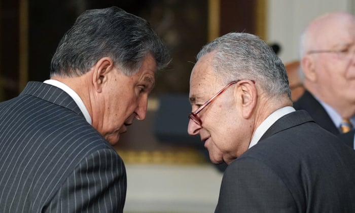 Senator Joe Manchin (left) and Senate majority leader Chuck Schumer talk at the White House in March.