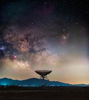 A Battle We Are LosingHaitong Yu (China). The Milky Way rises ominously above a small radio telescope from a large array at Miyun Station, National Astronomical Observatory of China, in the suburbs of Beijing. The image depicts the ever-growing light pollution we now experience, which together with electromagnetic noise has turned many optical and radio observatories near cities both blind and deaf – a battle that inspired the photographer’s title of the shot. The image used a light pollution filter (iOptron L-Pro) and multiple frame stacking to get the most of the Milky Way out of the city light