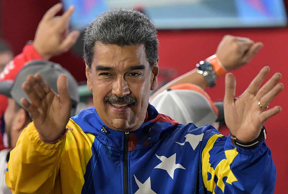 Nicolás Maduro greets supporters