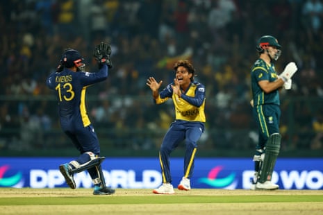 Dunith Wellalage and Kusal Mendis of Sri Lanka celebrate taking the wicket of Cameron Green.
