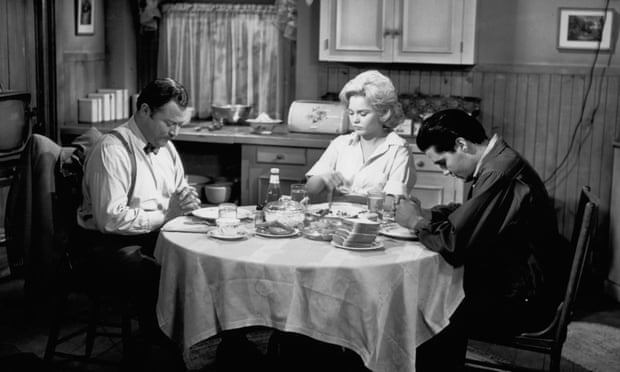 William Mims, Tuesday Weld and Elvis Presley pray in a scene from the 1961 film Wild in the Country.